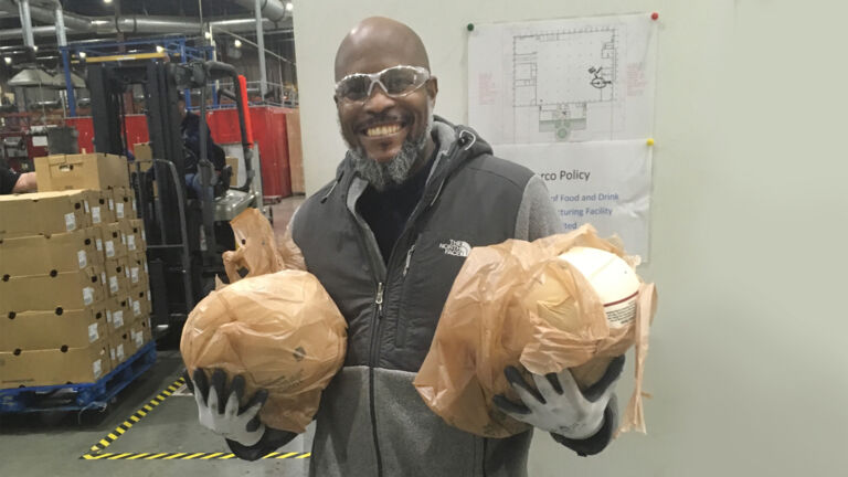 Watts employee donating turkeys